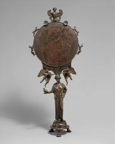 Bronze mirror with a support in the form of a draped woman