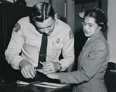 Rosa Parks being fingerprinted by Deputy Sheriff D.H. Lackey after being arrested on February 22, 1956, during the Montgomery bus boycott