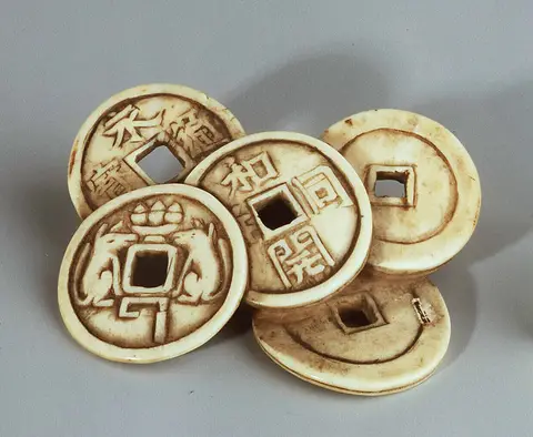 Netsuke: stack of coins
