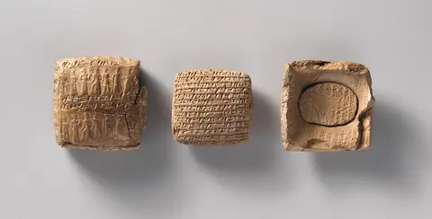 Cuneiform tablet case impressed with cylinder seal, for cuneiform tablets 1983.135.4a, b: private letter