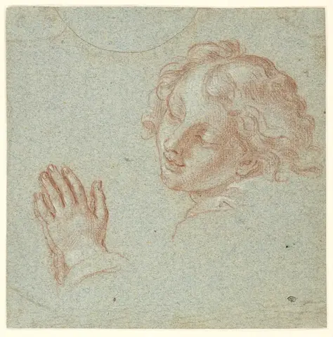 Head and hands of a praying youth